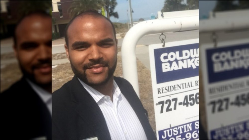 Justin Simpson near Coldwell Banker sign