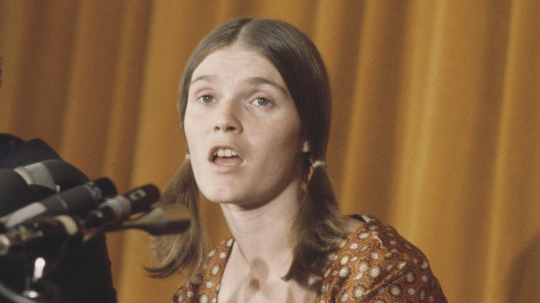 Linda Kasabian in the 1970s speaking into microphone