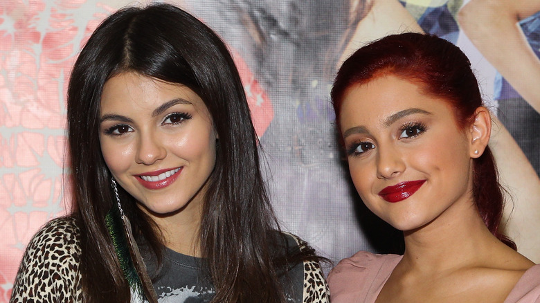 Victoria Justice smiles alongside Ariana Grande