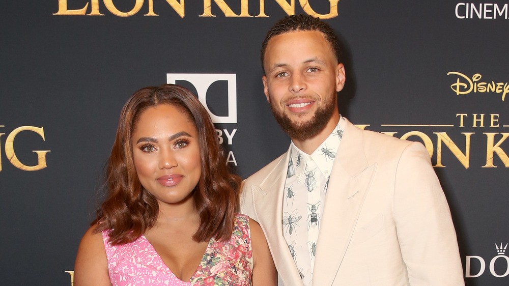 Steph Curry and Ayesha Curry posing