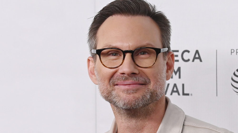 Christian Slater smirking