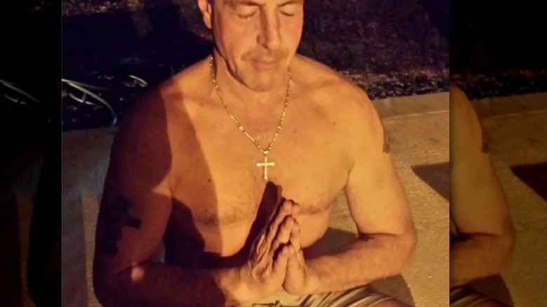 Michael Lohan praying 