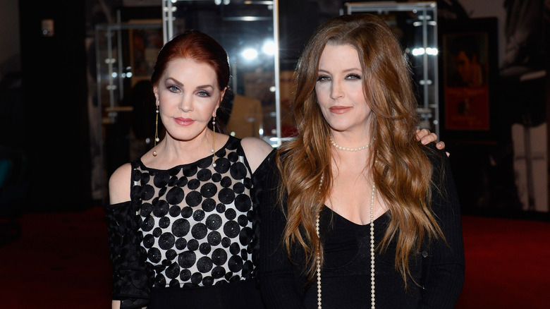 Priscilla Presley poses with hand on Lisa Marie's shoulder