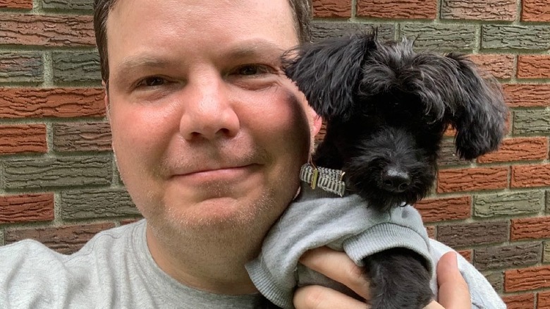 Michael Devine taking selfie with dog