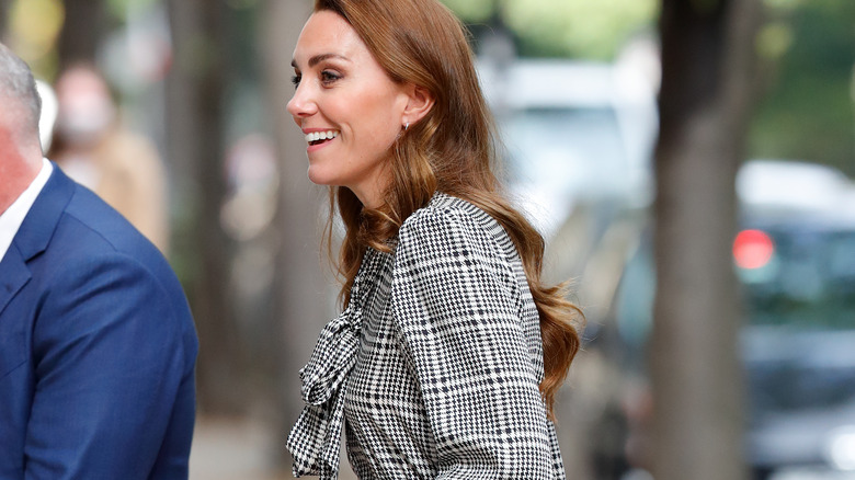 Kate Middleton smiles at a royal outing