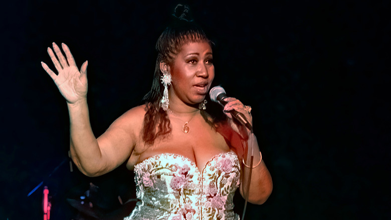 Aretha Franklin performing on stage