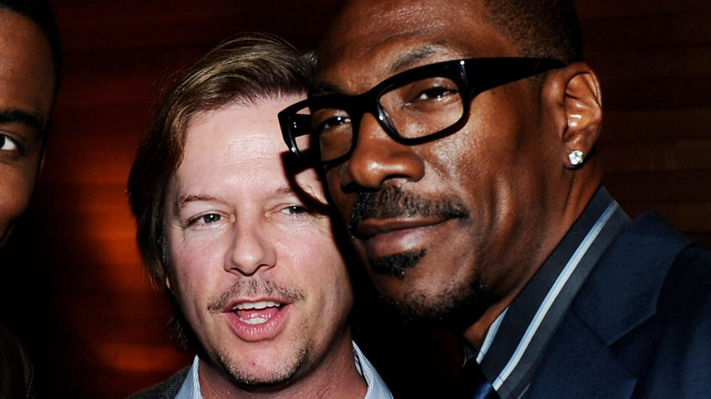 Eddie Murphy and David Spade, both smiling