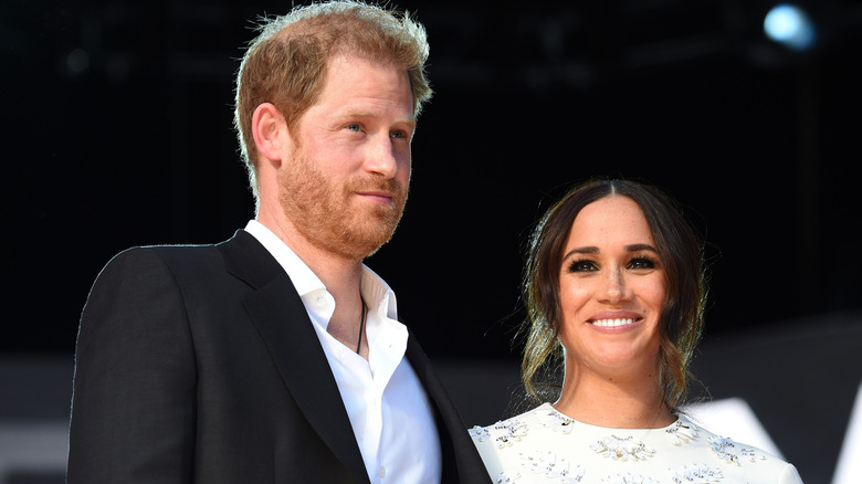 Prince Harry and Meghan Markle smiling