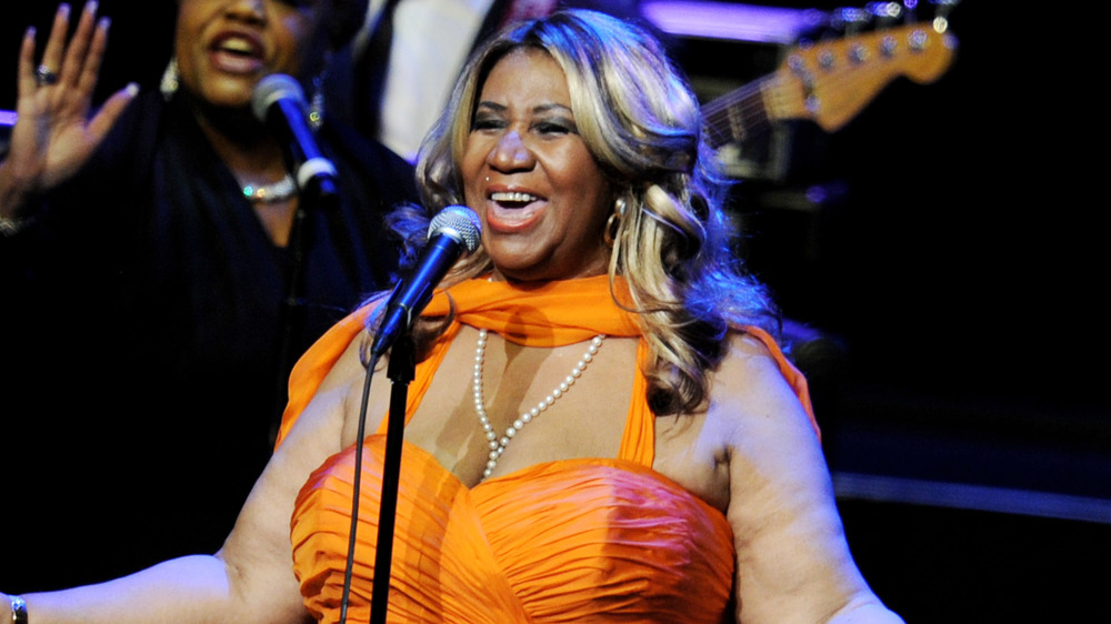 Aretha Franklin performing onstage in 2012