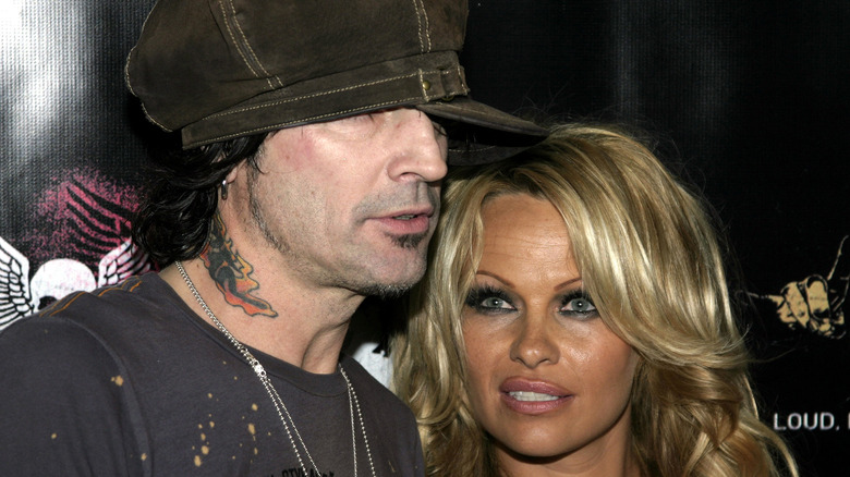 Tommy Lee and Pamela Anderson posing in the 1990s