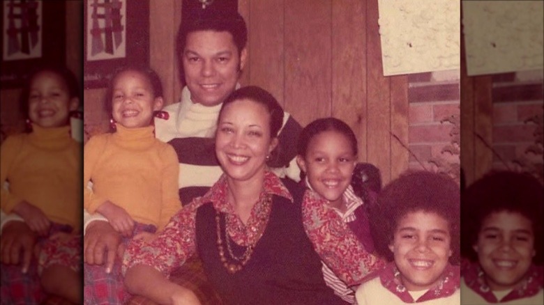 Colin Powell posing with his wife and children in throwback photo