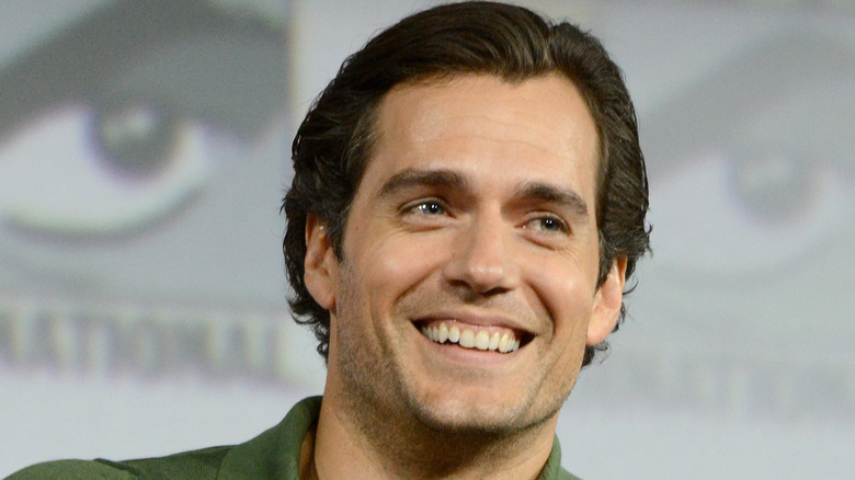 Henry Cavill green shirt smiling 