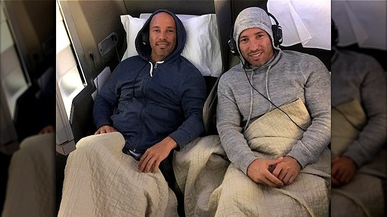 Jason and Brett Oppenheim on a flight