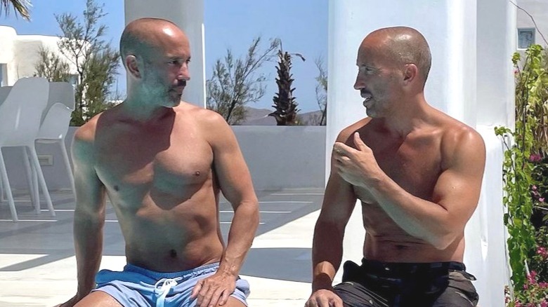 Brett and Jason Oppenheim by a pool