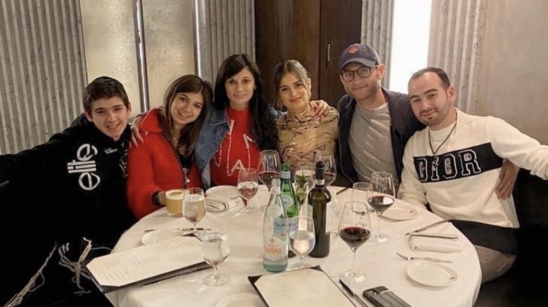 Julia Haart at a table with all four of her kids and Batsheva's husband