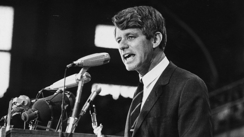 Robert F. Kennedy speaking into a microphone