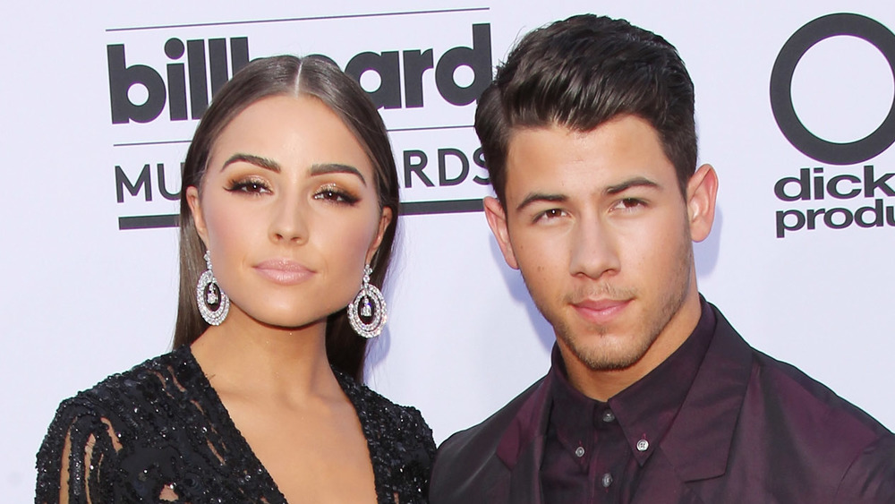 Olivia Culpo and Nick Jonas posing together