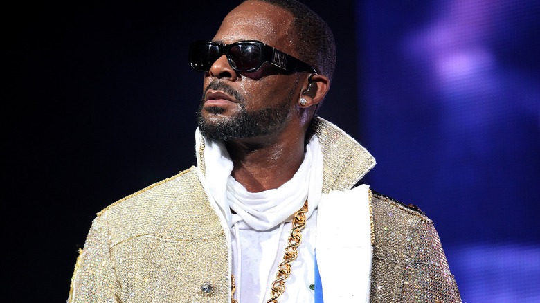 R. Kelly wearing dark sunglasses