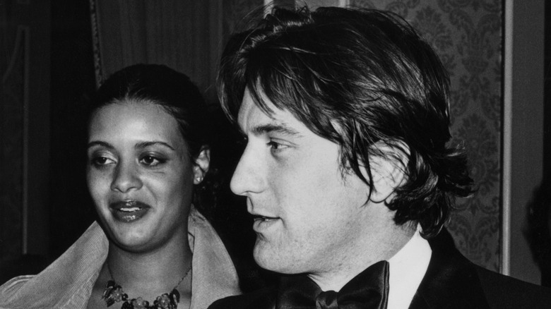 Diahnne Abbott and Robert De Niro at an event. 