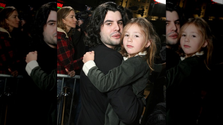 Sage Stallone holding Scarlet Stallone