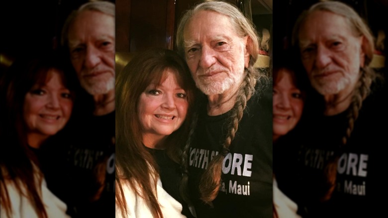 Renee Butts and Willie Nelson smiling