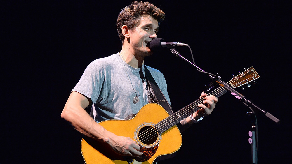 John Mayer singing and playing guitar