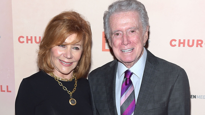 Joy and Regis Philbin smile on the red carpet