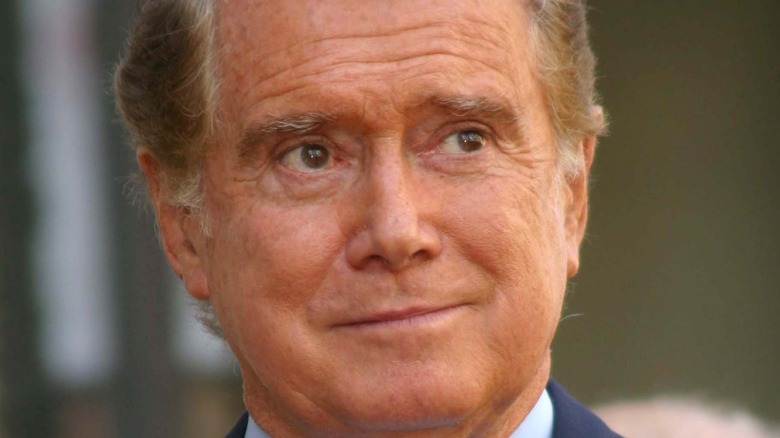 Regis Philbin smiles at an event