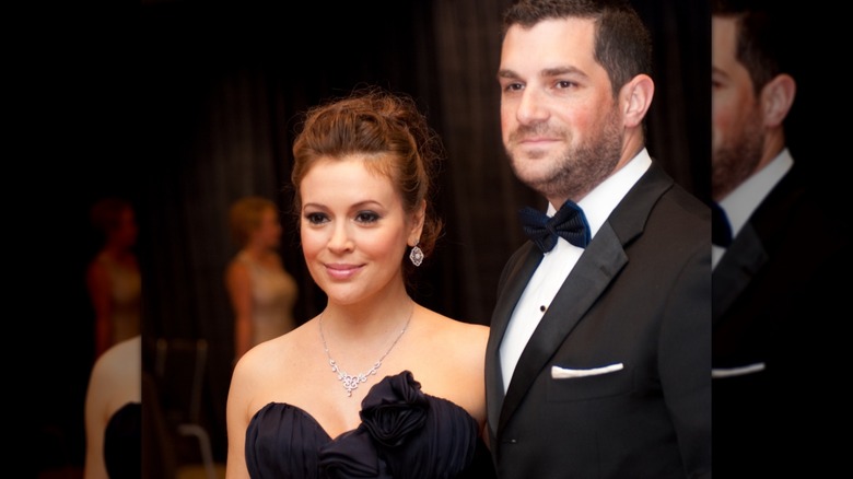 Alyssa Milano and David Buglari posing together.