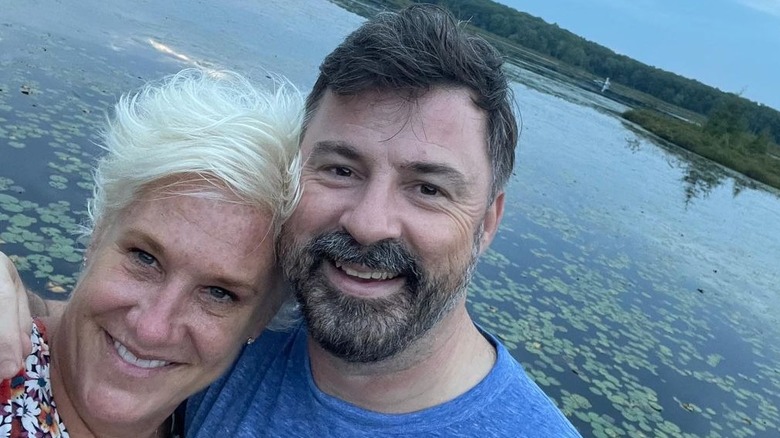 Anne Burrell and Stuart Claxton by a lake