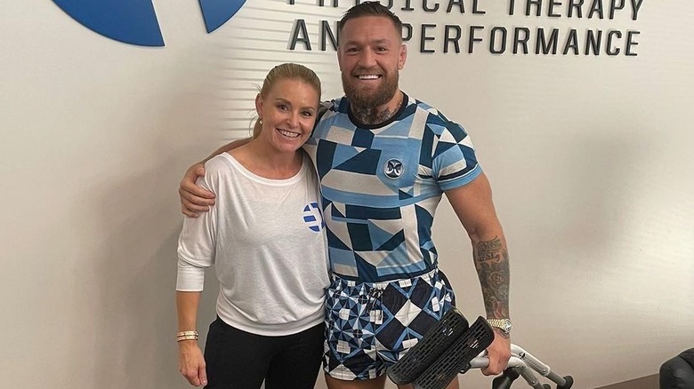 Heather Milligan posing with Conor McGregor