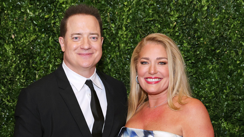 Brendan Fraser poses next to Jeanne Moore