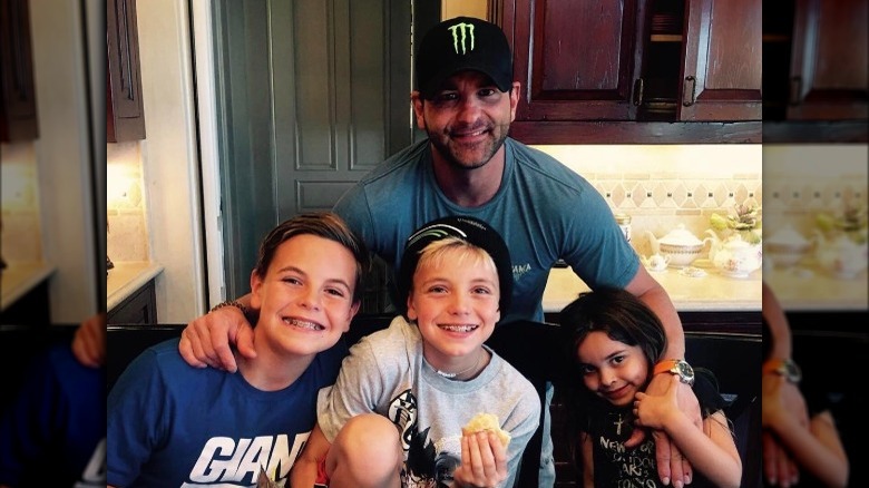 Bryan Spears, wearing a hat, 2017 photo with Britney's kids and his daughter