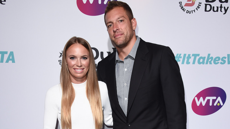 David Lee posing with Caroline Wozniacki