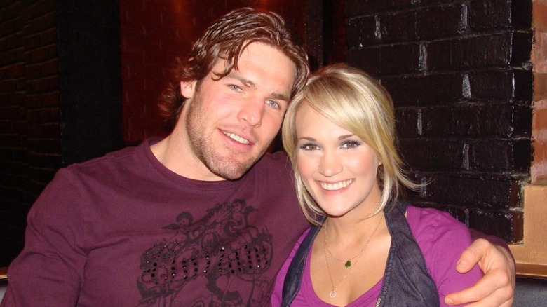 Mike Fisher and Carrie Underwood smiling together