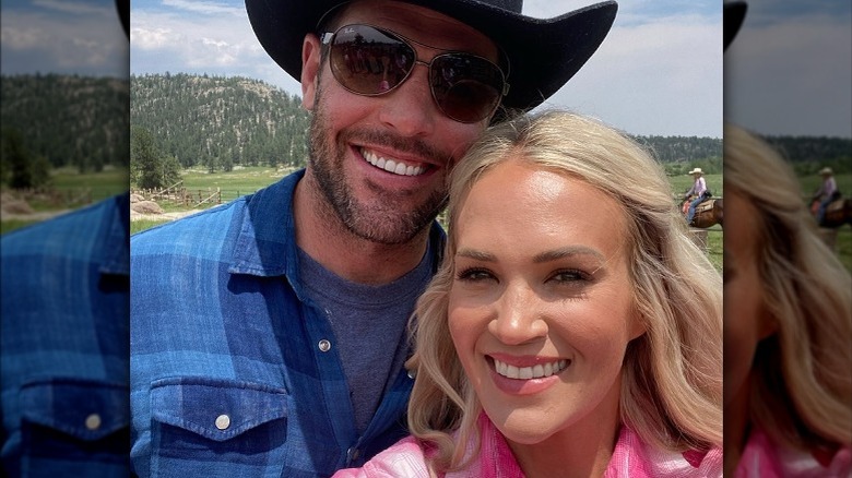 Mike Fisher and Carrie Underwood smiling together