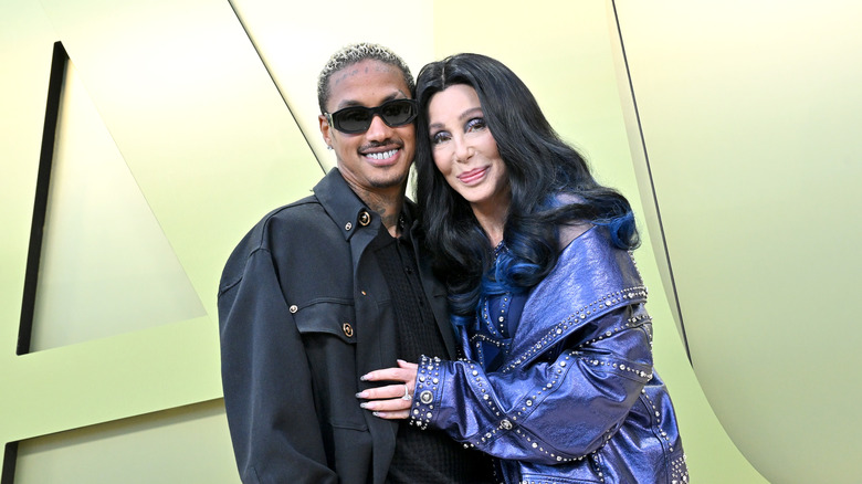 Alexander Edwards and Cher smiling at event