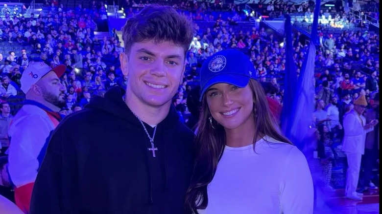 Cooper DeJean and Steph Wilfawn at a Philadelphia 76ers game