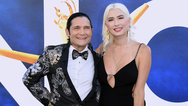 Corey Feldman and Courtney Anne Mitchell pose 