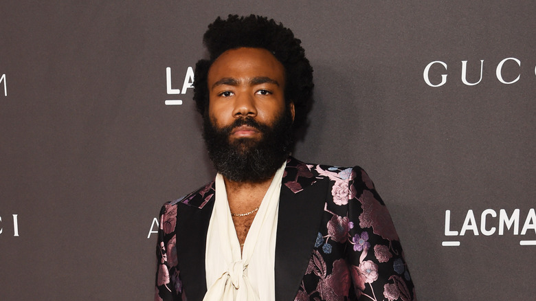 Donald Glover floral jacket pose