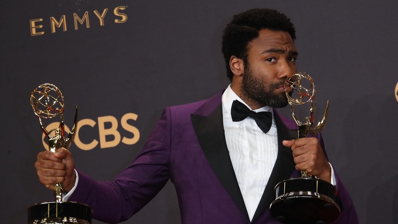 Donald Glover kisses Emmy awards