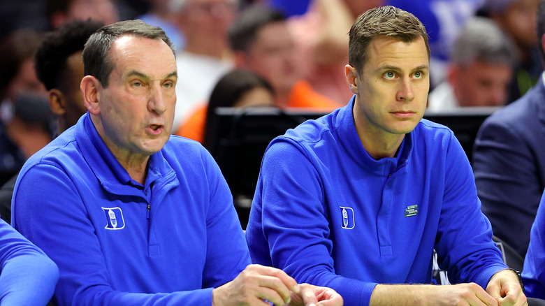 Jon Scheyer and Mike Krzyzewski sitting