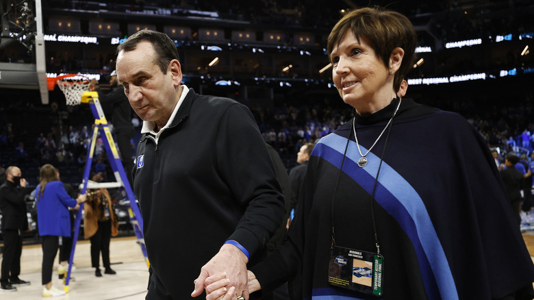 Mike Krzyzewski and wife Mickie hold hands 