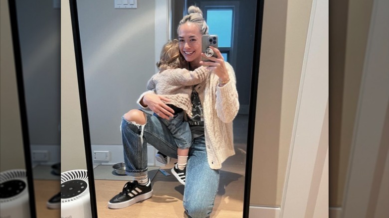 Andrea Thoma holding her daughter