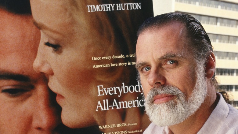 Taylor Hackford posing with movie poster