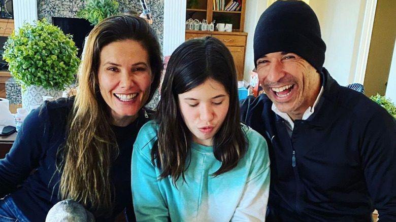 Adriana Henao and Helio Castroneves with their daughter