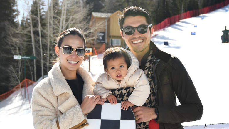 Henry Golding with wife and daughter