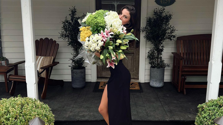 Samthana Robertson holding flowers