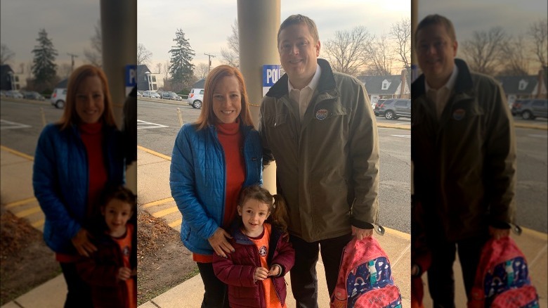 Psaki, Mecher, and daughter posing