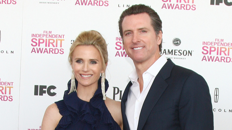 Jennifer and Gavin Newsom posing together on the red carpet